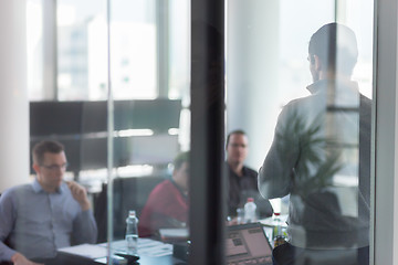 Image showing Business team leader delivering presentation in office.