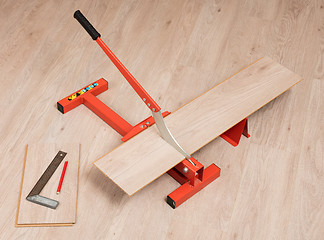 Image showing Red tool for cutting laminate