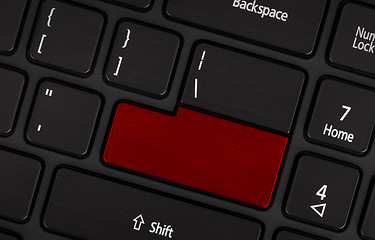 Image showing Laptop computer keyboard with blank red button