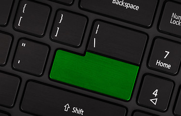 Image showing Laptop computer keyboard with blank green button