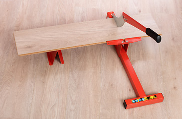 Image showing Red tool for cutting laminate