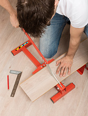 Image showing Red tool for cutting laminate