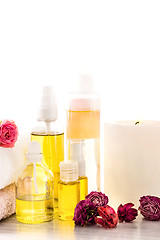 Image showing Spa setting with pink roses and aroma oil, vintage style 