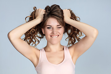 Image showing The young woman\'s portrait with happy emotions