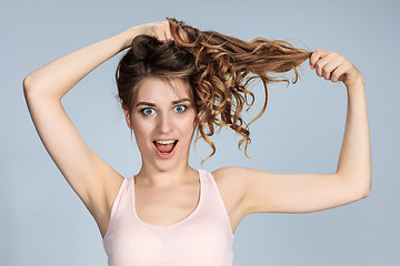 Image showing The young woman\'s portrait with happy emotions