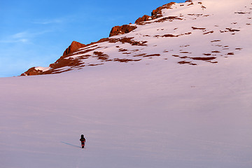 Image showing Hiker in sunrise snowy mountains