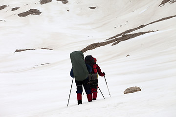 Image showing Two hikers on snowy plateau