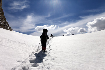 Image showing Two hikers on snow plateau