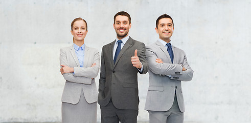 Image showing happy business team showing thumbs up