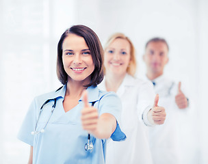 Image showing team of doctors showing thumbs up