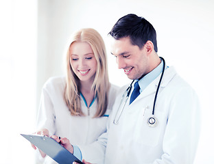 Image showing two doctors writing prescription