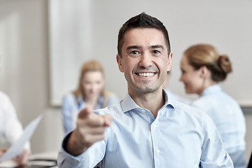 Image showing group of smiling businesspeople meeting in office