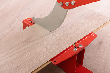 Image showing Red tool for cutting laminate