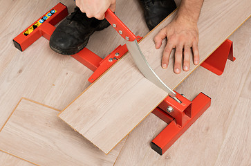 Image showing Red tool for cutting laminate