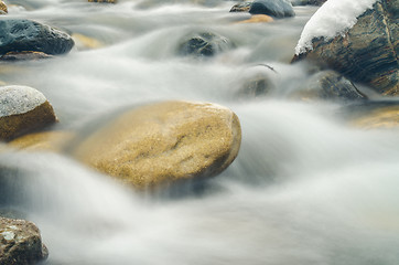 Image showing Current between rocks mountain river shot with long exposure