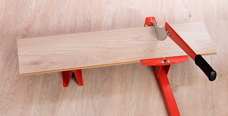 Image showing Red tool for cutting laminate