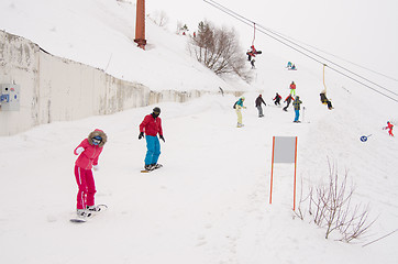 Image showing Dombay, Russia - February 7, 2015: People ride on the snow-covered slopes of the ski resort Dombai