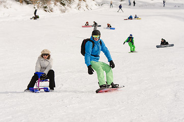 Image showing Dombay, Russia - February 7, 2015: People ride on the snow-covered slopes of the ski resort Dombai