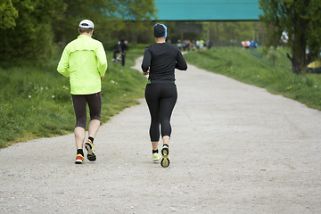 Image showing Young man and woman running 