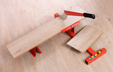 Image showing Red tool for cutting laminate