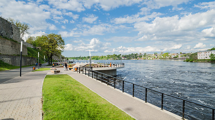 Image showing Narva River embankment with vacationers people and the border of Russia and the European Union