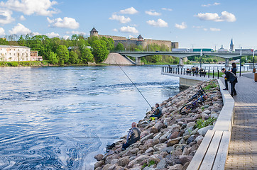 Image showing Narva River embankment with vacationers people and the border of Russia and the European Union