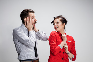 Image showing The business man and woman communicating on a gray background