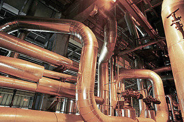 Image showing Equipment, cables and piping as found inside of a modern industr