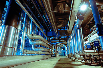 Image showing different size and shaped pipes and valves at a power plant 