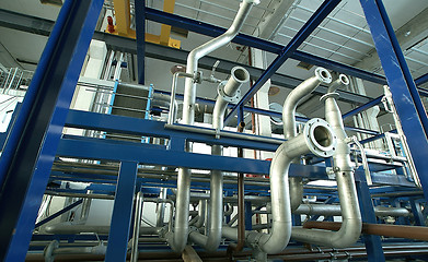 Image showing Equipment, cables and piping as found inside of a modern industr