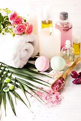 Image showing Spa setting with pink roses and aroma oil, vintage style 