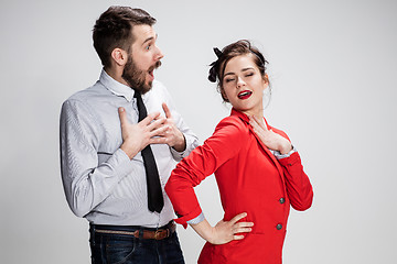 Image showing The business man and woman communicating on a gray background