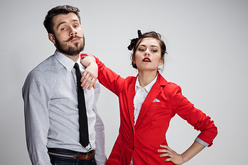 Image showing The business man and woman communicating on a gray background