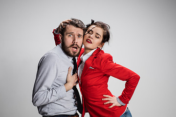 Image showing The business man and woman communicating on a gray background