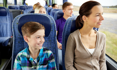 Image showing happy family riding in travel bus