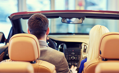 Image showing couple sitting in cabriolet car at auto show