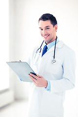 Image showing male doctor writing prescription