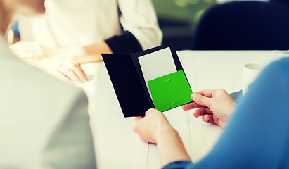 Image showing close up of woman hands holding restaurant bill