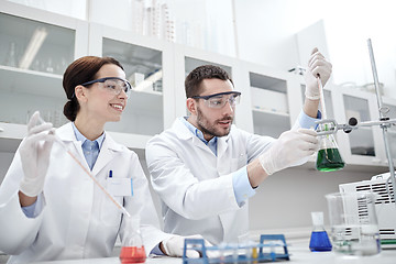 Image showing young scientists making test or research in lab