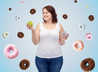 Image showing happy plus size woman choosing apple or cookie