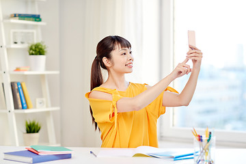 Image showing asian woman student taking selfie with smartphone