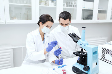 Image showing young scientists making test or research in lab