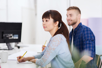 Image showing happy creative team or students working at office