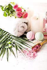 Image showing Spa setting with pink roses and aroma oil, vintage style 