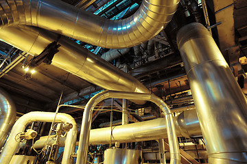 Image showing Equipment, cables and piping as found inside of a modern industr