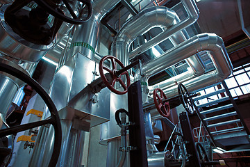 Image showing Equipment, cables and piping as found inside of a modern industr