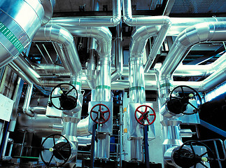 Image showing Equipment, cables and piping as found inside of a modern industr