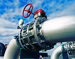 Image showing Industrial zone, Steel pipelines and valves against blue sky