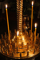Image showing dimly burning church candles
