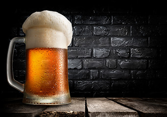 Image showing Beer and brick wall